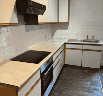 After Image 1- Kitchen cabinets degreased/re-aligned, worktop and flooring restored to provide a clean finish. landlord property refurbishment in Northampton