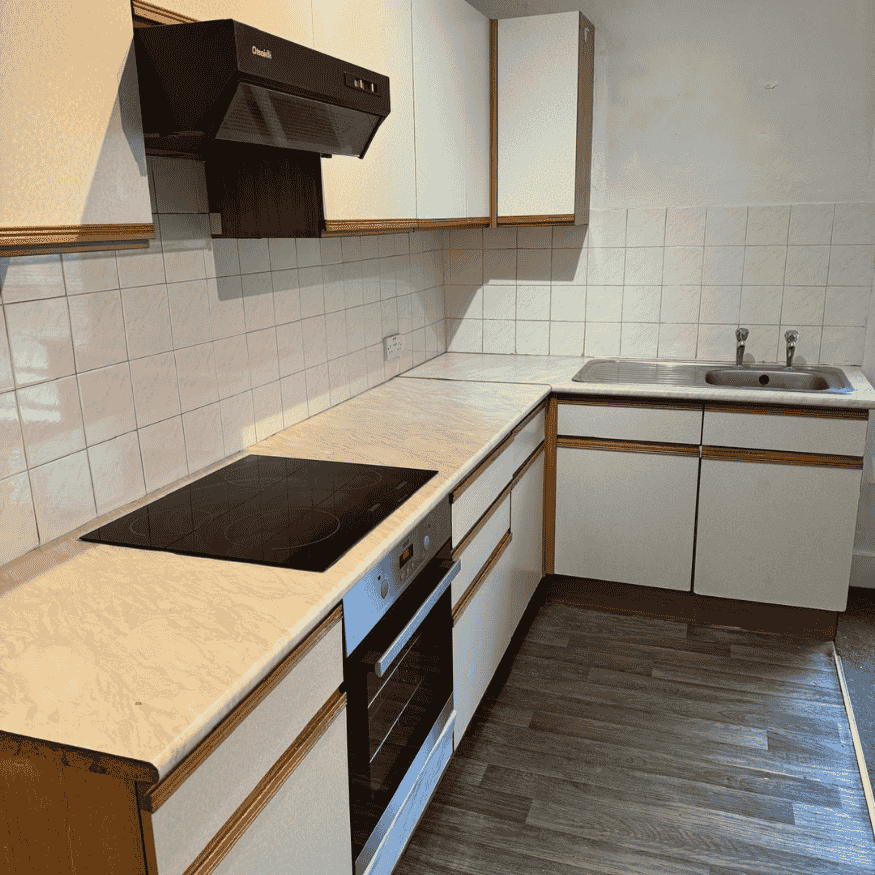 After Image 1- Kitchen cabinets degreased/re-aligned, worktop and flooring restored to provide a clean finish. landlord property refurbishment in Northampton