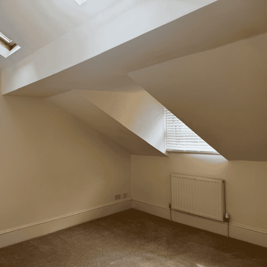 Before: Worn-out flooring and dated decor prior to renovation.